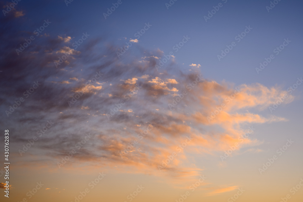 Beautiful colorful sunset sky with clouds and sunlight.