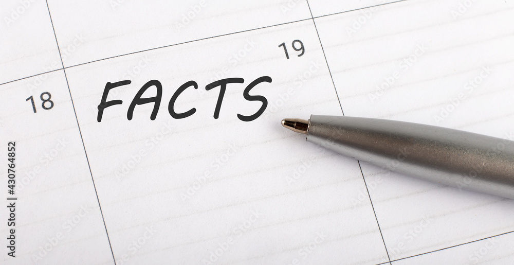 Text FACTS written on calendar planner to remind you an important appointment with a pen on isolated white background. Text FACTS written on calendar planner to remind you an important appointment with a pen on isolated white background.