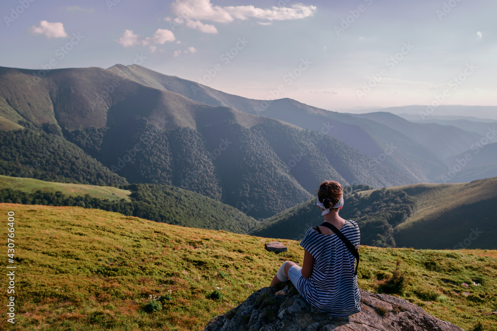 Girl Tourist resting on the Mountain Trail Hike Backpacking Girl Tourist resting on the Mountain Trail Hike Backpacking