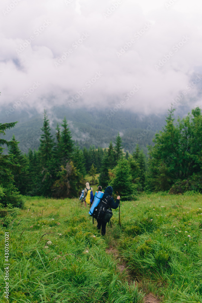 People Hiking Mountain Trail Path at Foggy Day People Hiking Mountain Trail Path at Foggy Day