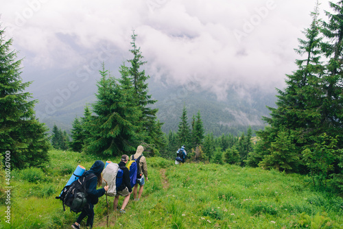 People Hiking Mountain Trail Path at Foggy Day © innadril