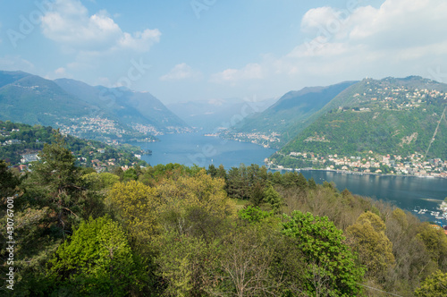 Panoramic aerial view of the city of Como facing the famous Lake Como and the surrounding mountains