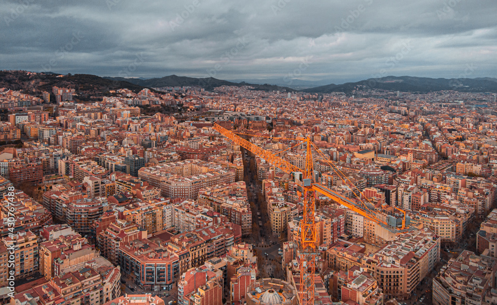Obraz premium The Cathedral of La Sagrada Familia by the architect Antonio Gaudi, Catalonia, Barcelona Spain - April 2021. Aerial view