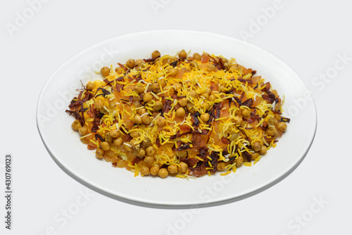 chickpea biryani served in while ceramic plate, Cooked chickpea with steamed yellow rice
