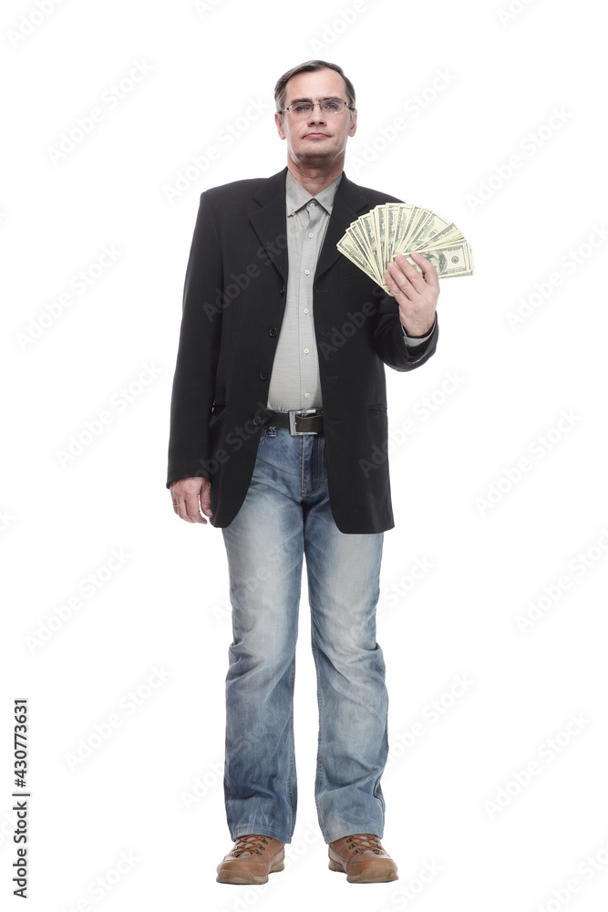 in full growth. serious business man with dollar bills. in full growth. serious business man with dollar bills.