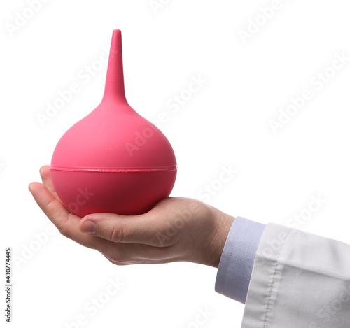 Doctor holding pink enema on white background, closeup