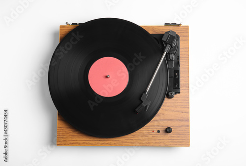 Modern vinyl record player with disc on white background, top view