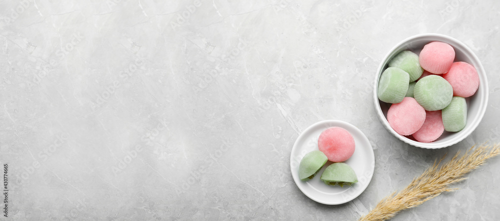 Delicious mochi and pampas grass on light grey marble table, flat lay with space for text. Traditional Japanese dessert - obrazy, fototapety, plakaty 