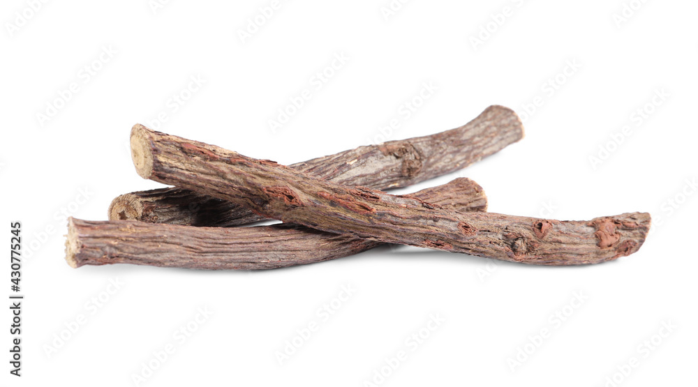 Dried sticks of liquorice root on white background Dried sticks of liquorice root on white background