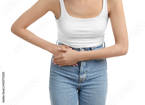 Woman suffering from appendicitis inflammation on white background, closeup © New Africa