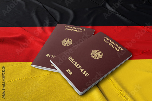 A German passport on the flag of Germany, citizenship by investment