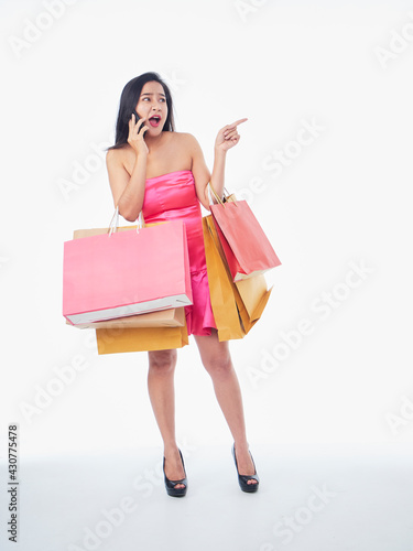 Woman with shopping bags and smartphone