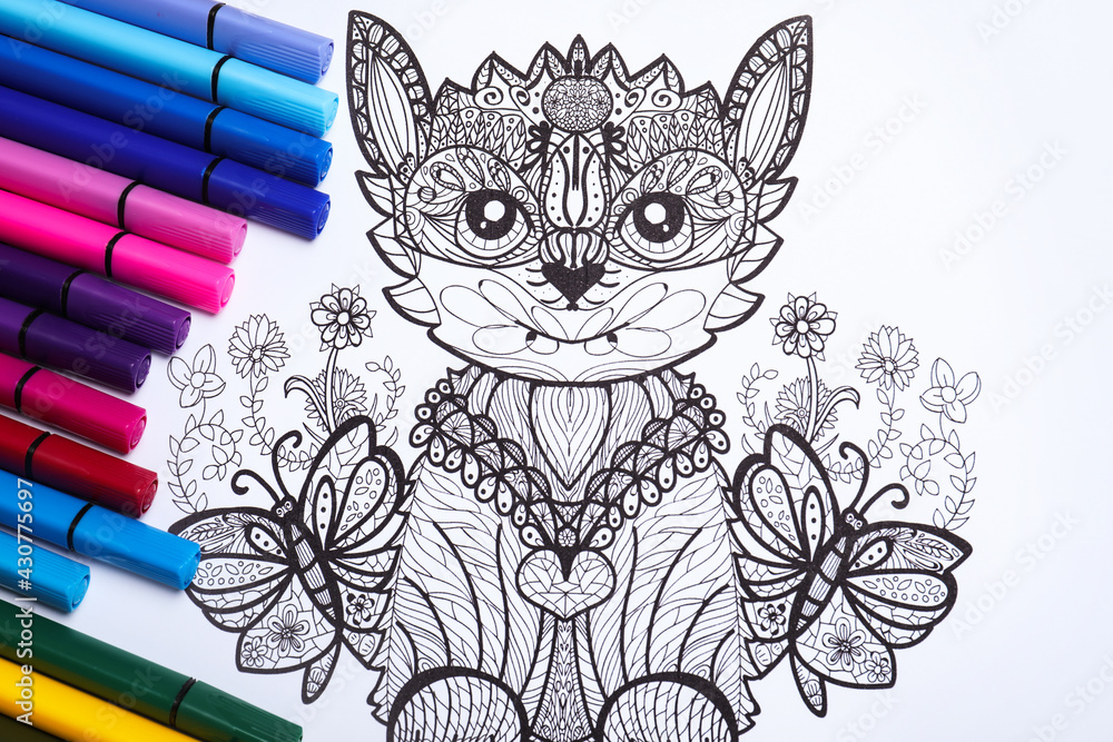 Felt tip pens on antistress coloring page, top view