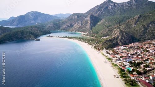 Amazing high angle top drone view on world famous paragliding and parasailing turkish spot for extrim parachute sport in Oludeniz in Fethiye, Turkey
