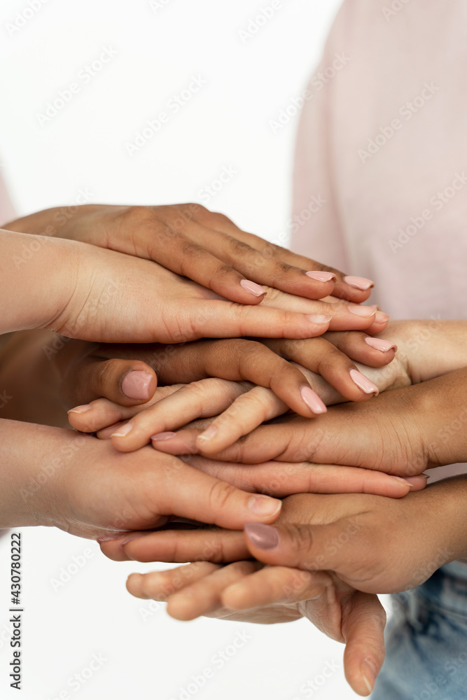Different ethnicity female hands. Multicultural diversity and friendship. Different ethnicity female hands. Multicultural diversity and friendship.