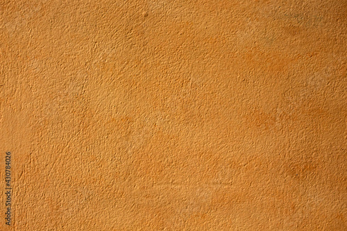 close-up of orange  painted cement wall
