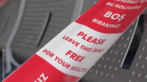 Airport, seats for passengers in departure terminal with Red and White Lines of barrier tape. Coronavirus COVID-19. Travel tourism checking board airline travelers tourists flight boarding plane