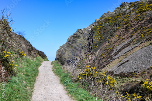 Footpath through country hiking route on a coastal walk uk