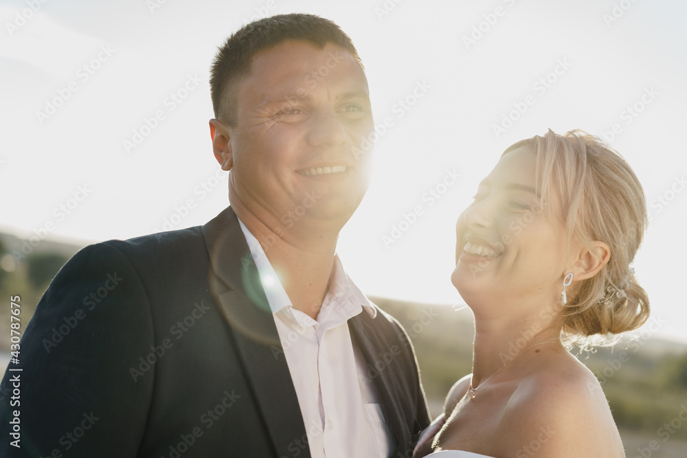 Portrait of a bride and groom in a sunset light Portrait of a bride and groom in a sunset light