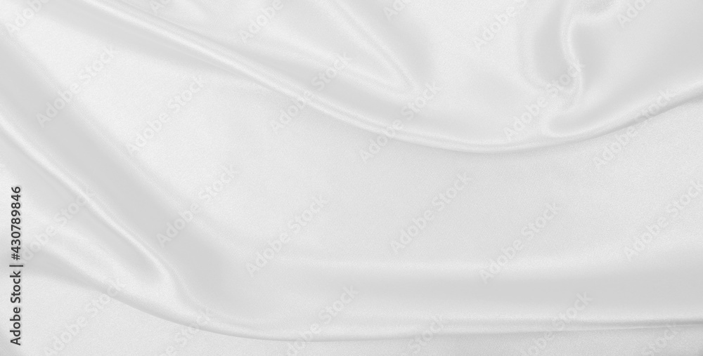 Obraz premium Smooth elegant white silk or satin luxury cloth texture as wedding background. Luxurious background design