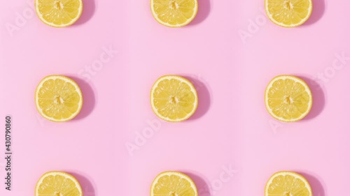 Wallpaper Mural Creative pattern made of citrus fruits rotating and changing on pastel pink background. Stop motion Torontodigital.ca