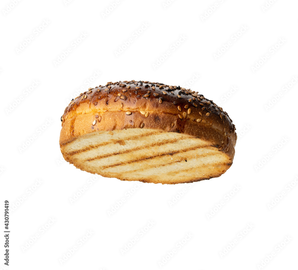 top half of baked round bun made of white wheat flour with sesame seeds for hamburger top half of baked round bun made of white wheat flour with sesame seeds for hamburger