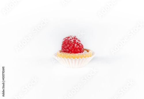 Mini tart with berries isolated, delicious tiny cakes on white background,  small raspberry cake, sweet mini pie, gourmet dessert close-up