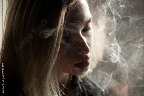 Young Woman Smoking Cigarette