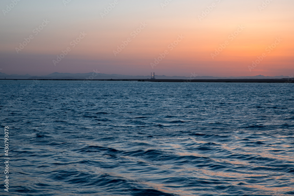 Sunset over the Red Sea and oil platforms. Sunset over the Red Sea and oil platforms.