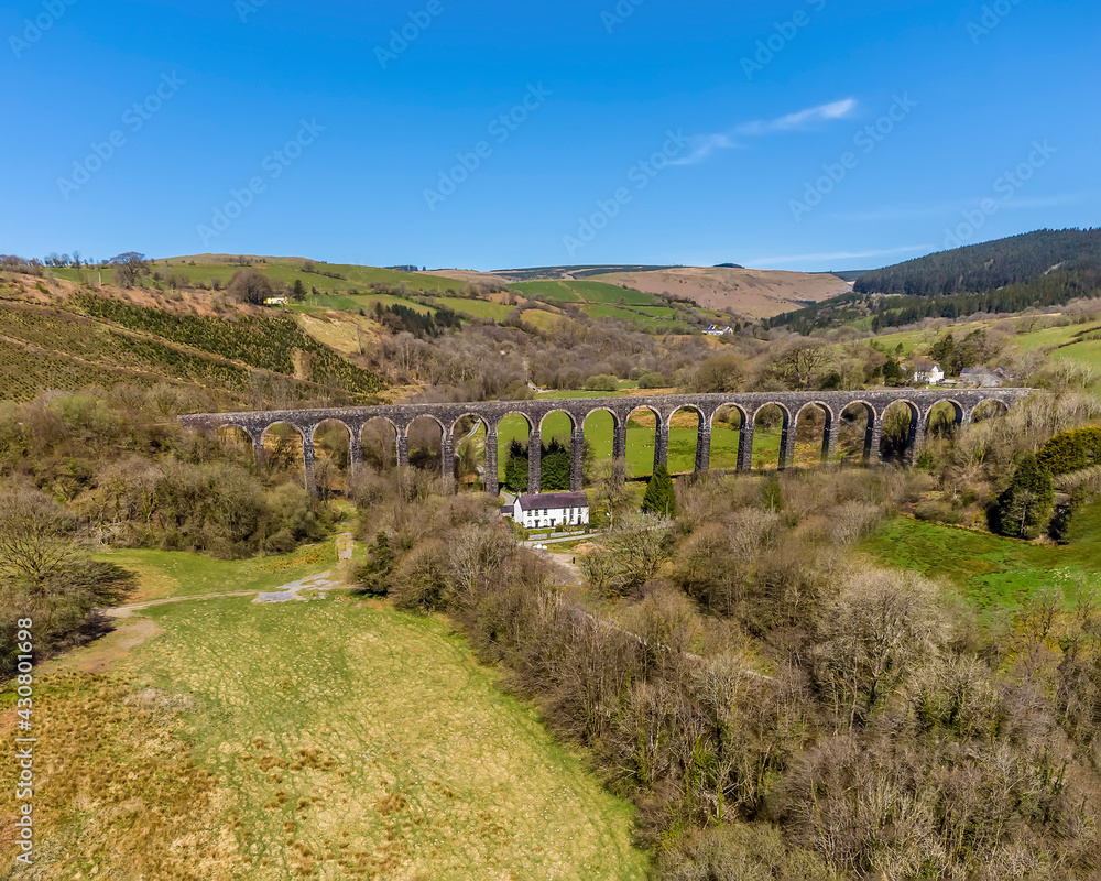 An aerial view of the Victorian railway viaduct stretching across the vally at Cynghordy, Carmarthenshire, South Wales on a sunny day