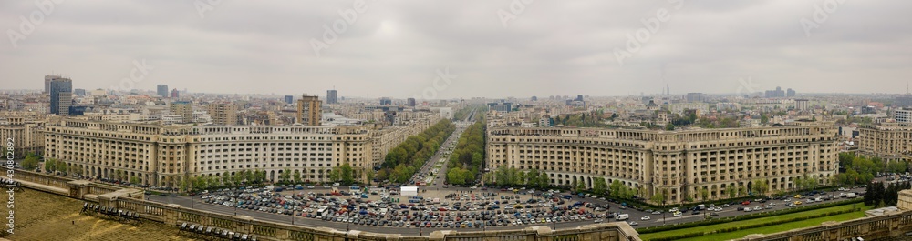 Fototapeta premium Bucharest, Romania - April 29, 2021: Panorama of Bucharest as seen from the Palace of Parliament, on a cloudy spring day.