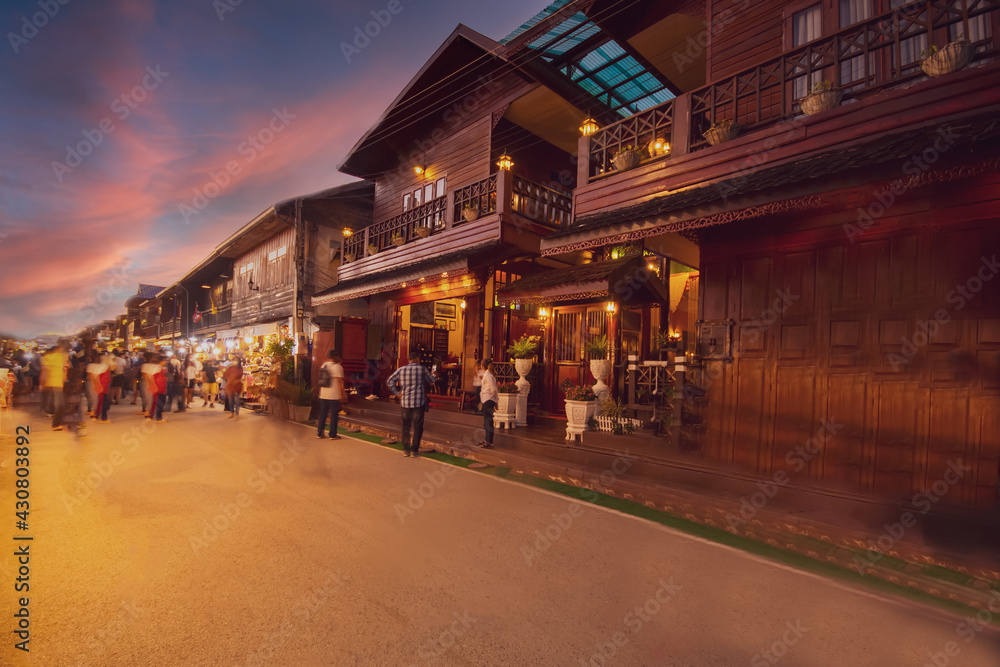 Blurred walking Loei Chiang Khan walking street and night market,Thailand people in street market at twilight with bokeh , Chinag Khan , Thailand_.jpg
