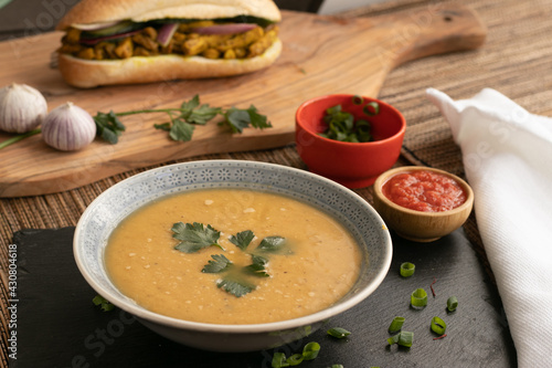 Dahl soup with yellow lentils on a table, lunch or dinning