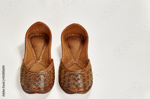 Traditional pure leather footwear (jutti) from India on a white background