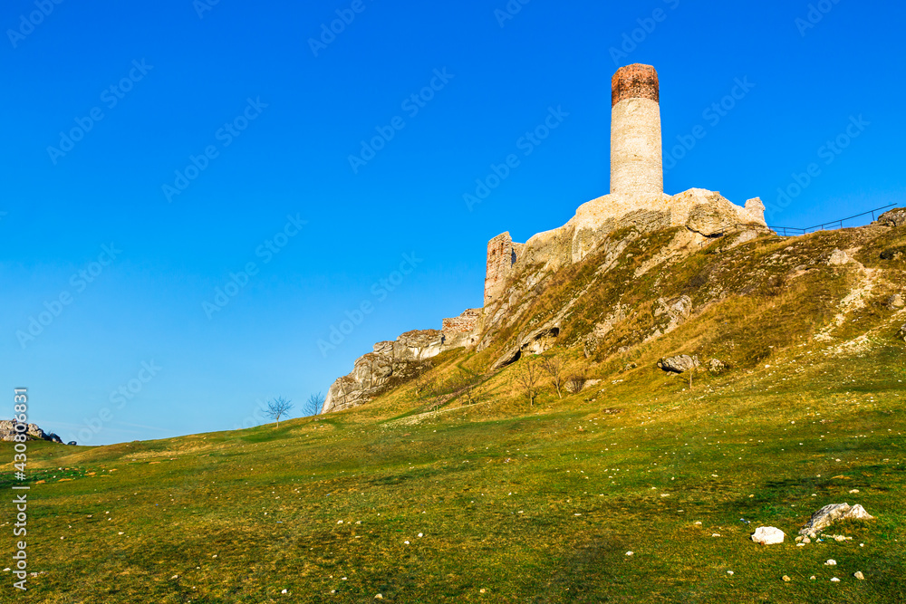 Ruins of medieval royal castle on the limestone rocks, Olsztyn Poland. Krakow-Czestochowa Upland, the Polish Jurassic Highland