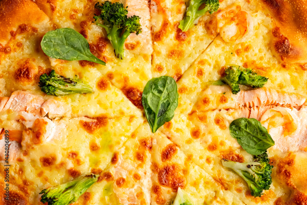 Pizza is not a wooden board. Black background. close-up. Pizza is not a wooden board. Black background. close-up.