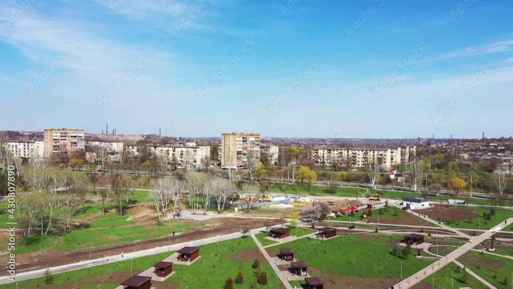 An industrial city from a bird's eye view. You can see residential buildings, a recreation park, on the horizon pipes of industrial enterprises An industrial city from a bird's eye view. You can see residential buildings, a recreation park, on the horizon pipes of industrial enterprises