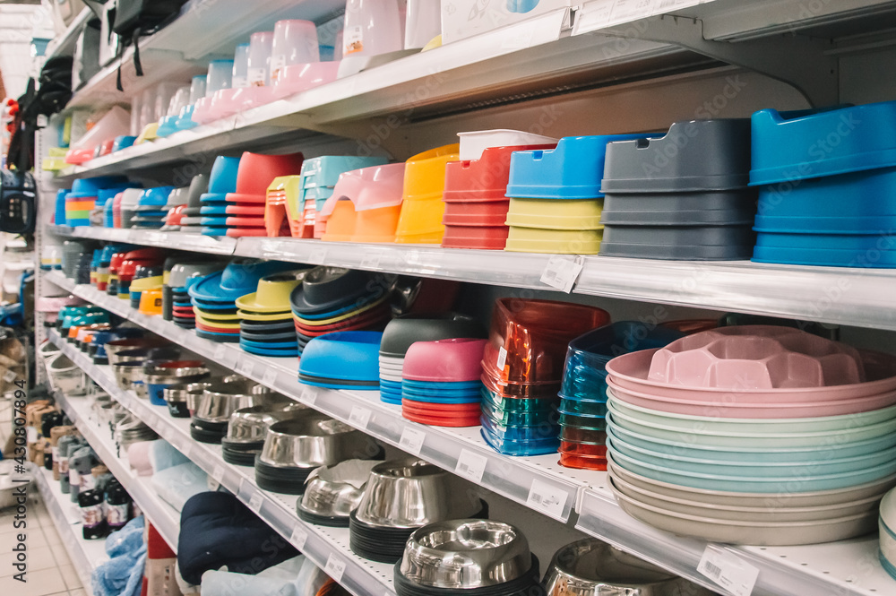 Interior of pet store with large assortment of pet accessories, bowls for  pets Stock Photo | Adobe Stock