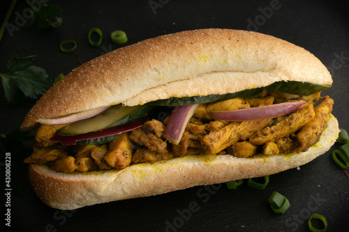 Indian Surinamese sandwiches filled with roti chicken curry, cod fish or tandoori chicken 