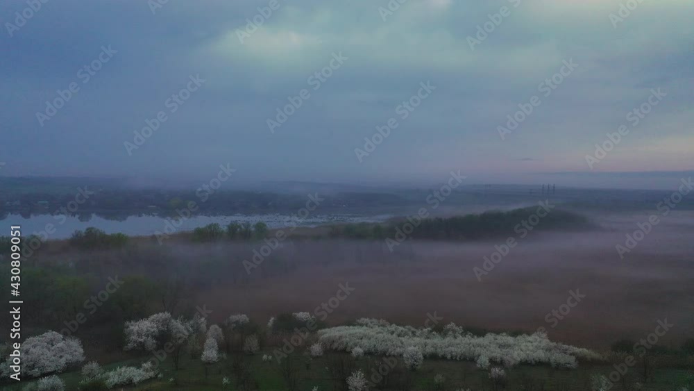 Flight in the evening over the clearing in a covered haze Flight in the evening over the clearing in a covered haze