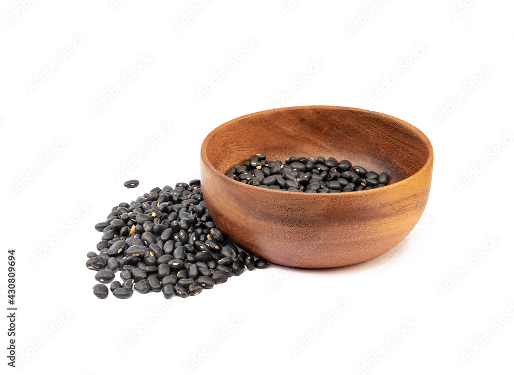 Black beans in wooden bowl on white background Black beans in wooden bowl on white background