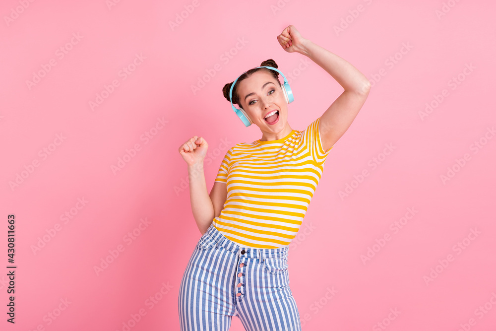 Photo of hooray nice brunette lady dance wear headphones t-shirt pants isolated on pink background Photo of hooray nice brunette lady dance wear headphones t-shirt pants isolated on pink background