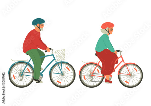 Seniors on bicycles. Senior man and woman in helmet riding bike.