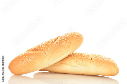 Two delicious fragrant bagels with a jute napkin, close-up, isolated on white.