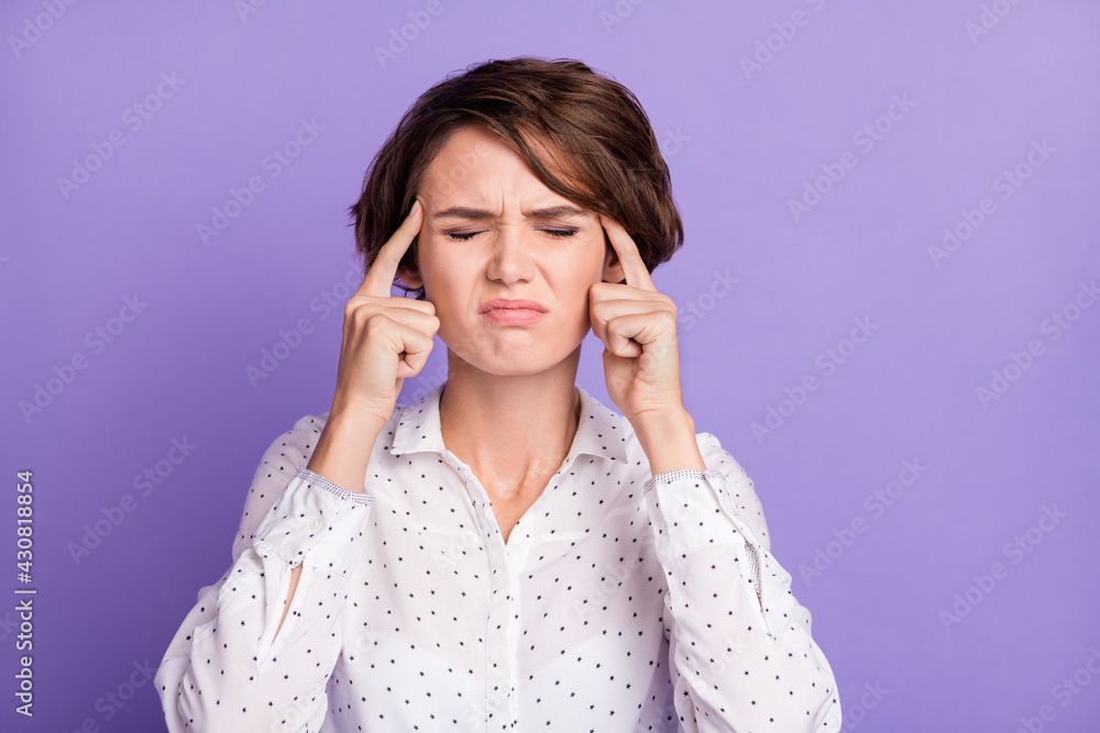Photo of negative lady closed eyes fingers on temple annoyed irritated isolated on violet color background Photo of negative lady closed eyes fingers on temple annoyed irritated isolated on violet color background