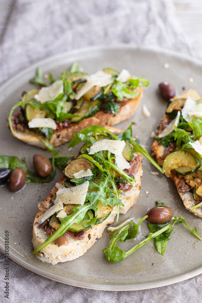 Vegetarian bruschette with olives and courgettes Vegetarian bruschette with olives and courgettes