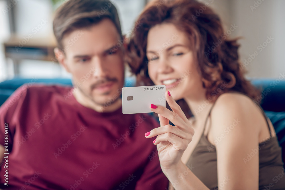Young couple choosing something for buying online Young couple choosing something for buying online
