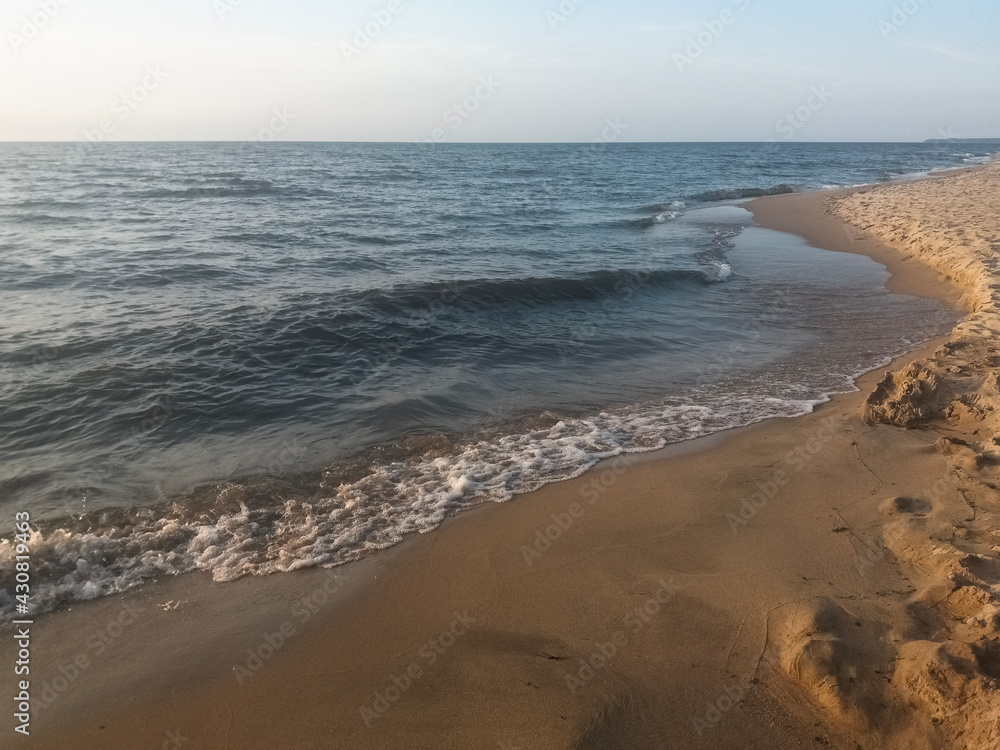 Beautiful sunset on Lake Baikal with a view of the sandy beach Beautiful sunset on Lake Baikal with a view of the sandy beach