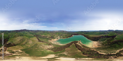 360 degree aerial photo of Nicoletti lake in Sicily. Immersed in a luxuriant nature and destination of numerous migratory birds. Relax around the lake. Water sports in the heart of Sicily. photo