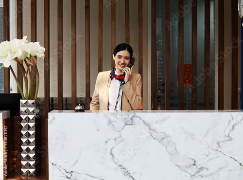 Asia reception woman smile portrait in reception area at hotel.